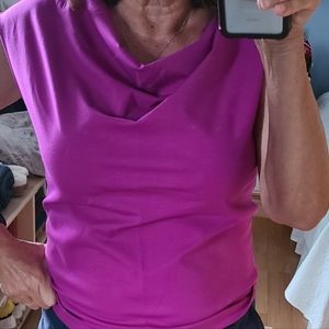 A pullover top in purple/pink